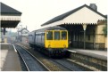 Cl 104 DMU pauses at Miles Platting station