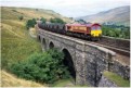 66 114 heads a southbound coal train over Ais Gill viaduct
