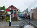 River Mite pushes its train back into the carriage shed